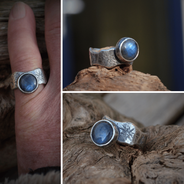 Ring met labradoriet en sterreninslag in de ringband